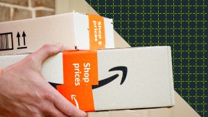 Hands holding Amazon packages.